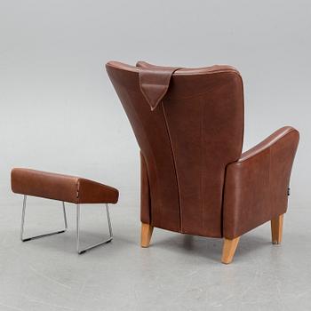 A 'Stepp' easy chair width stool by Carl-Henric Spak for Swedese.