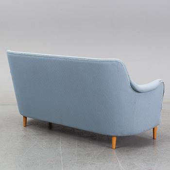 A 'Samsas' sofa and easy chair by Carl Malmsten dared 1985.