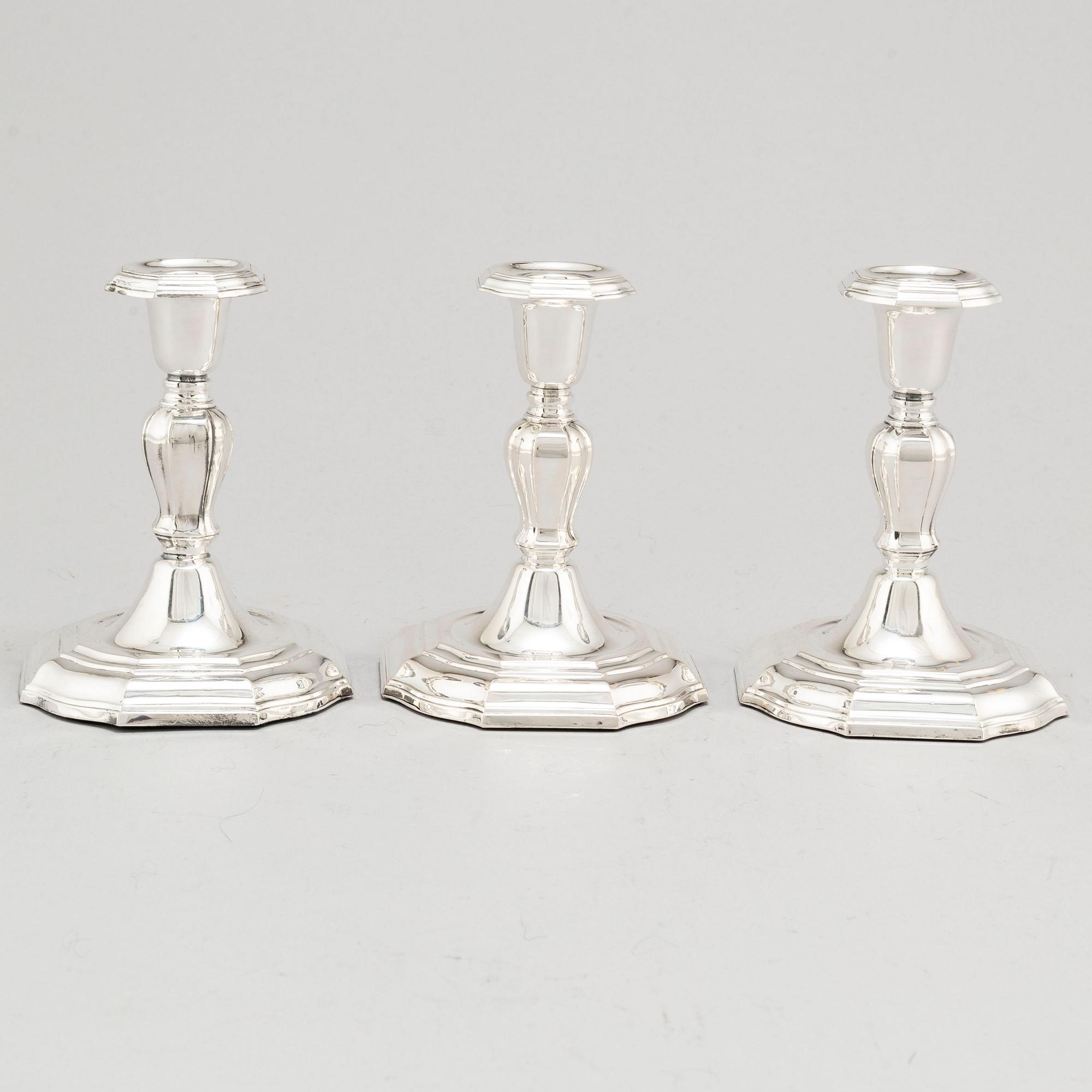 A set of three Swedish silver candlesticks, maker's mark CG Hallberg, Stockholm 1955-1957.
