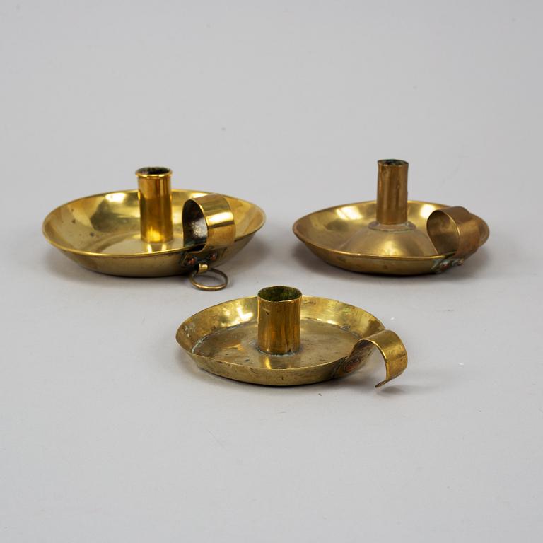 Three 19th century brass night light holders.