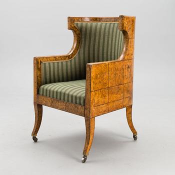 A RUSSIAN ARMCHAIR, Carelian birch, early 19th century.