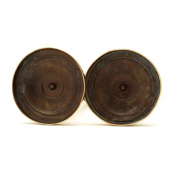 A pair of Empire  early 19th century candlesticks.