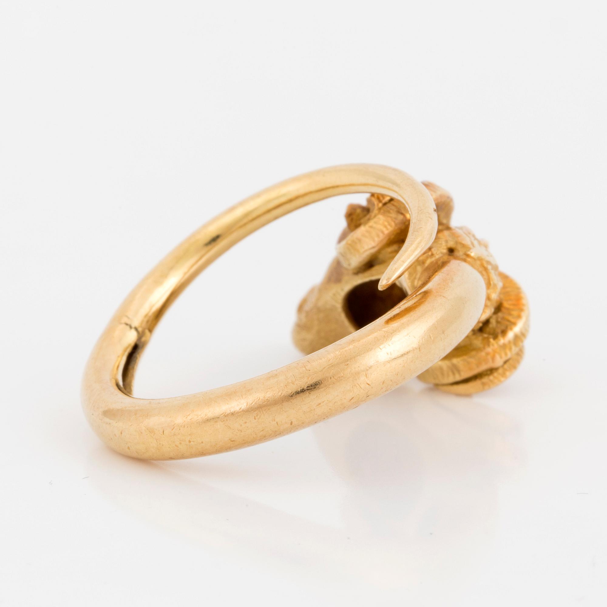 An 18K gold ring.
