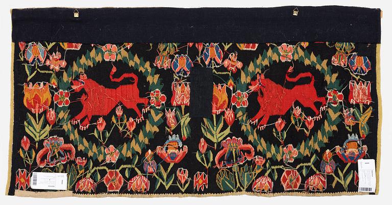 A cushion, 'Red Lion' (Rött Lejon), tapestry weave, c. 98 x 49 cm, Southwestern Scania, first part of the 19th century.