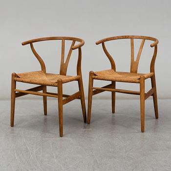 A pair of armchairs, 'Wishbone Chair' by Hans J Wegner, Carl Hansen & Son, Odense, Denmark.