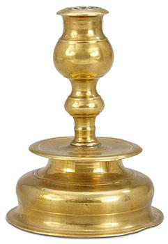 A Baroque brass candlestick.