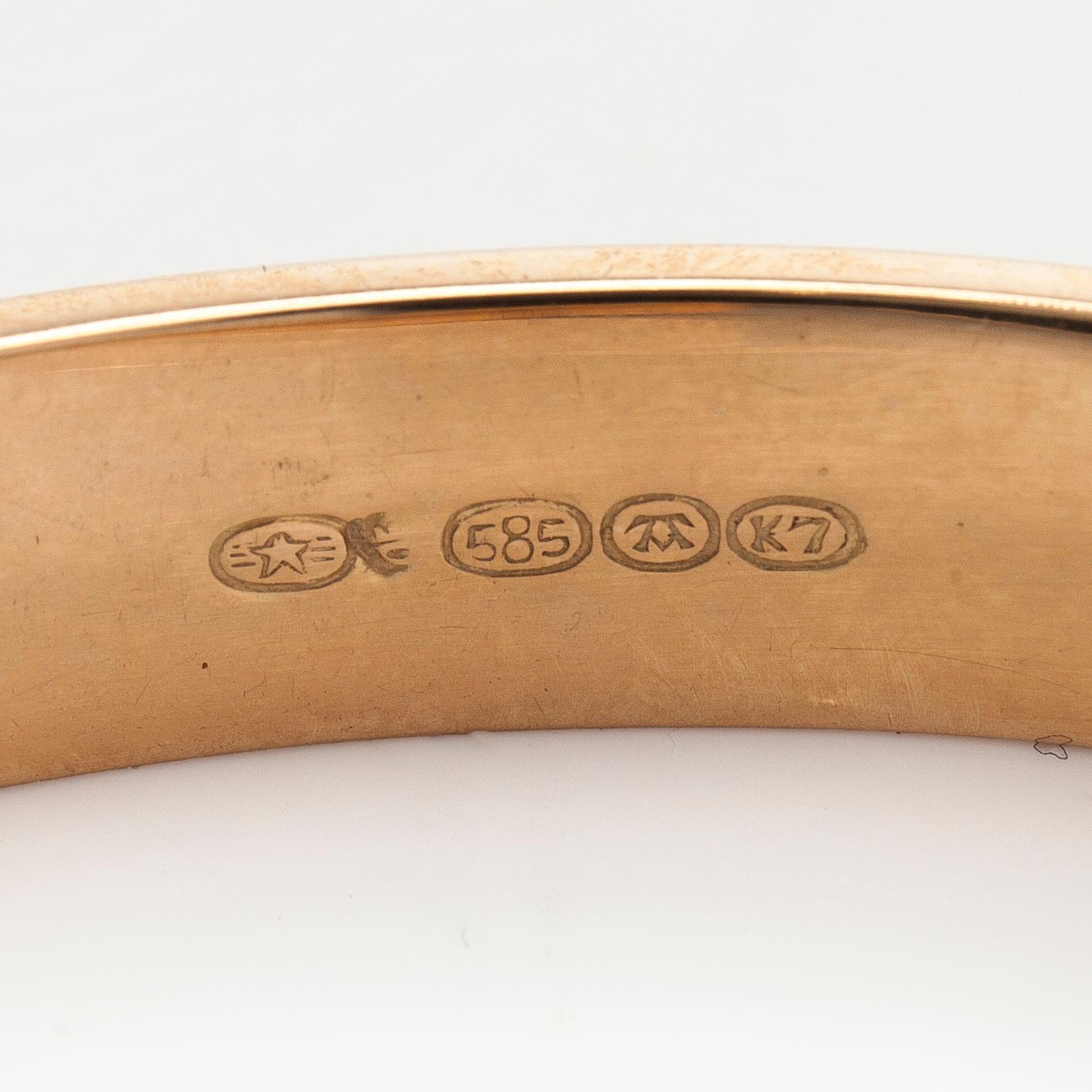 A 14K gold bracelet.
