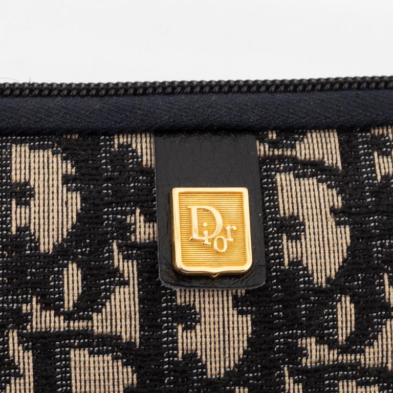 Christian Dior, a black canvas umbrella, toilet bag, coin purse and wallet.