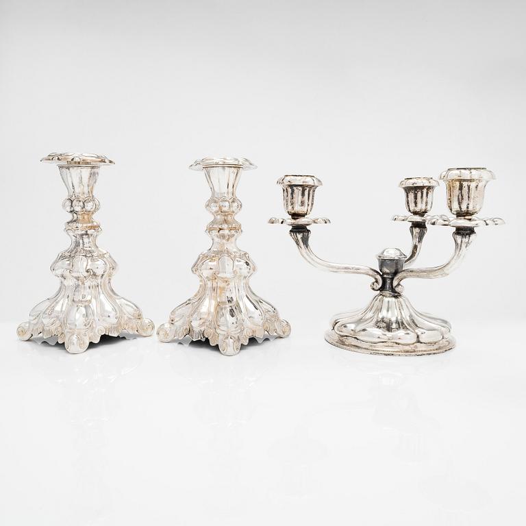 A mid-20th century silver candelabra and two candlesticks.