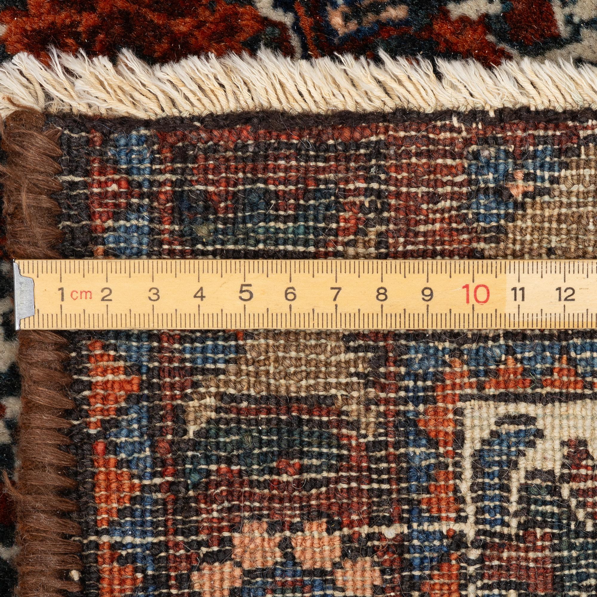 An antique/semi-antique Abadeh rug, Western Iran, c. 202 x 150 cm.