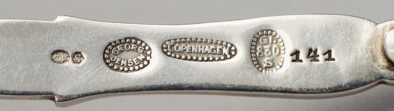 A silver sauce bowl with spoon, Copenhagen 1915-21. Design nr 233 and 141.