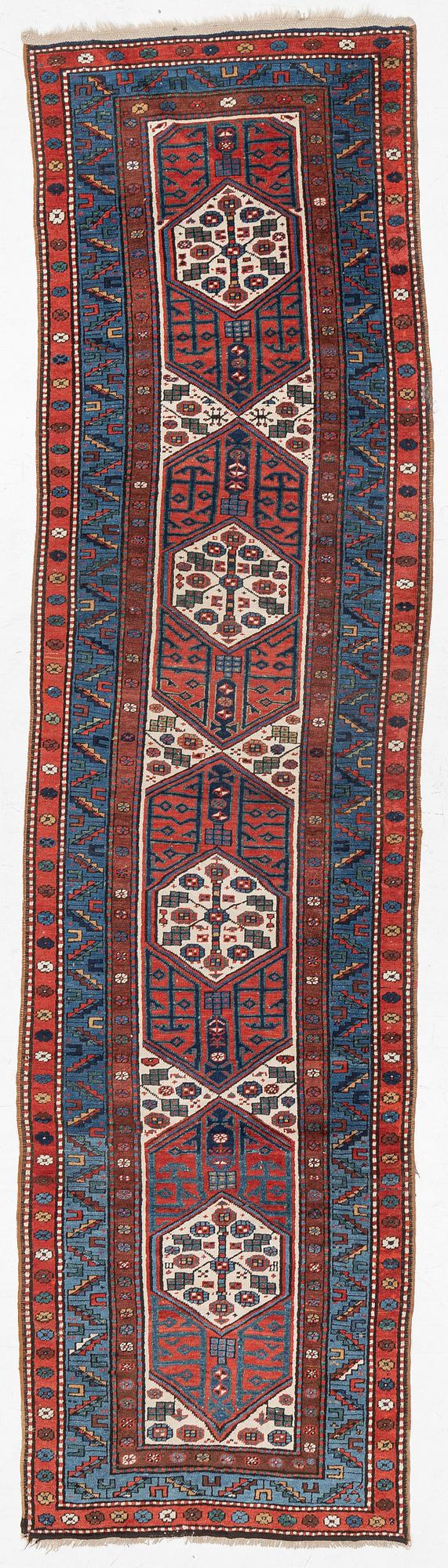 An antique Kurdish runner, probably,. 406 x 105 cm.