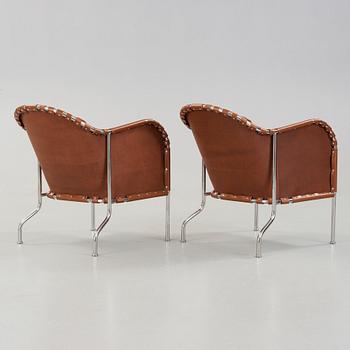 Mats Theselius, A pair of 'Bruno' brown leather and steel easy chairs, Källemo, Sweden.