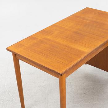 A teak veneered desk, 1950's/60's.