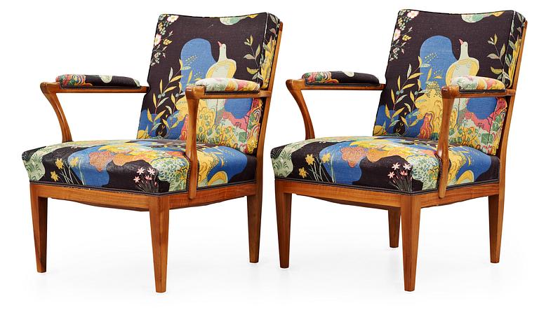 A pair of Josef Frank valnut armchairs by Svenskt Tenn.