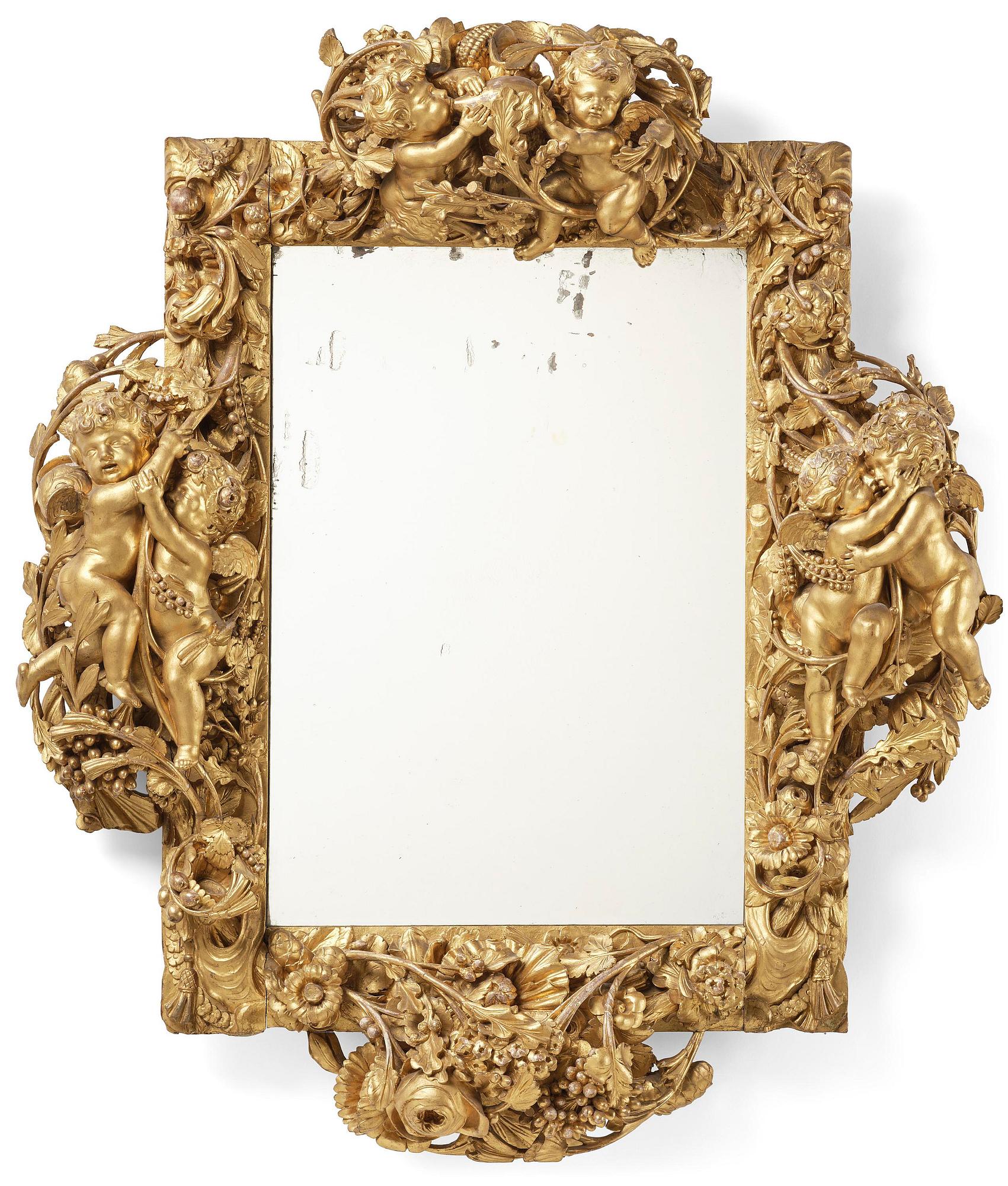 A presumably Dutch Louis XIV carved giltwood frame with mirror glass, in the style of Jean Le Pautre, late 17th century.