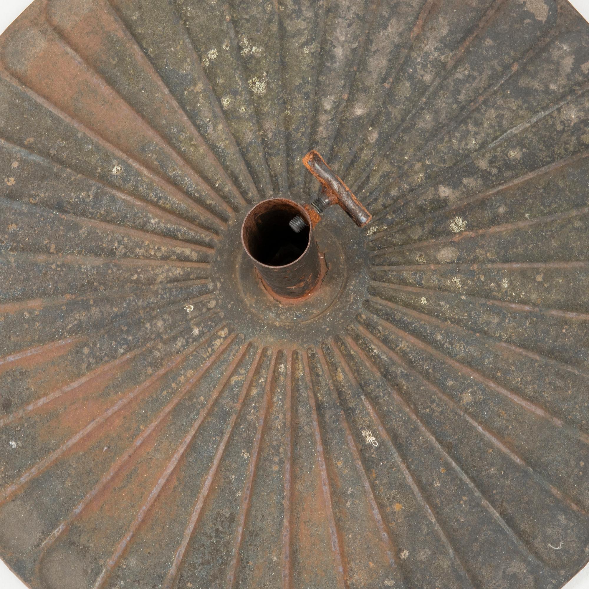 Parasol base, cast iron, early 20th century.