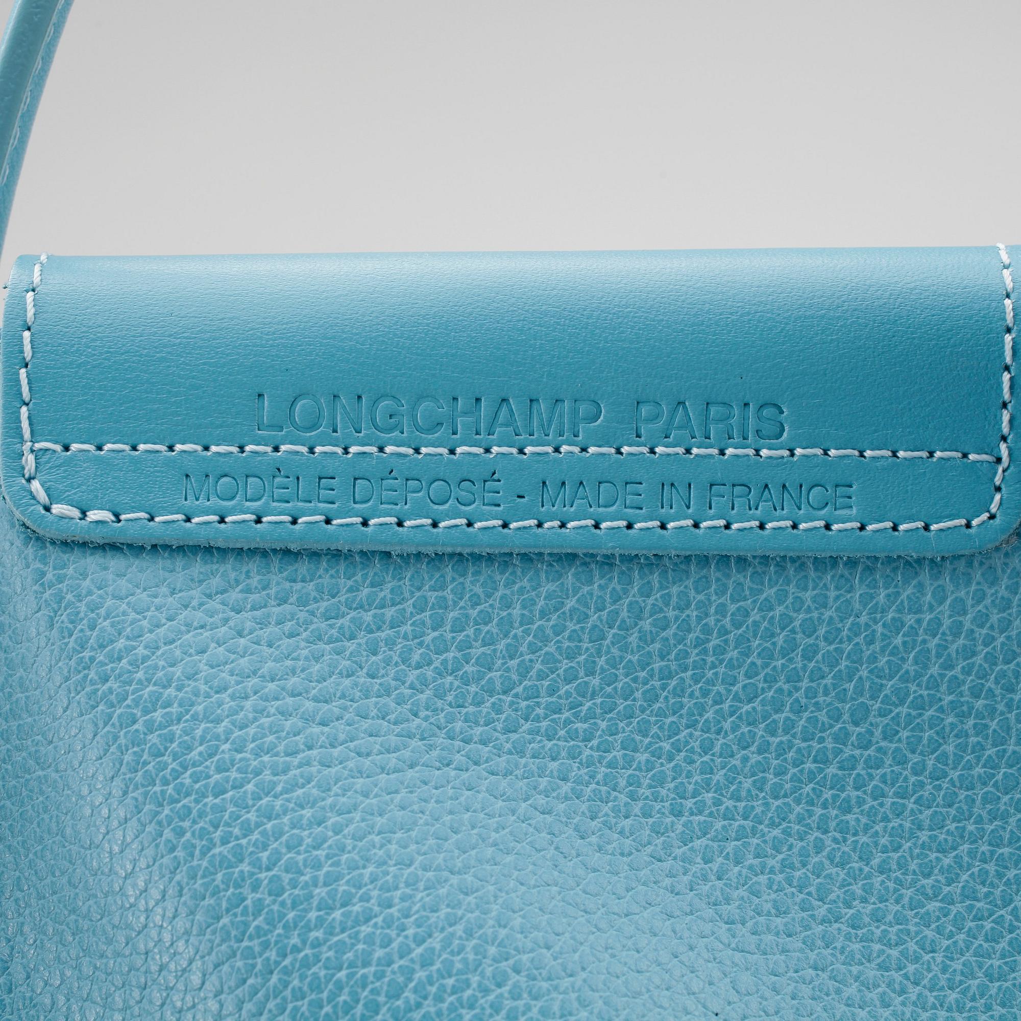 LONGCHAMP, a baby blue leather bag.