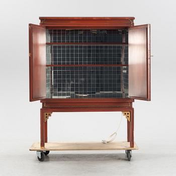 A bar cabinet, purchased in Tokyo around the 1950s. Partly built by late Qing dynasty panels.