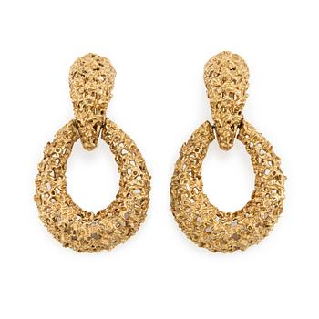 A pair of 18K gold earrings.