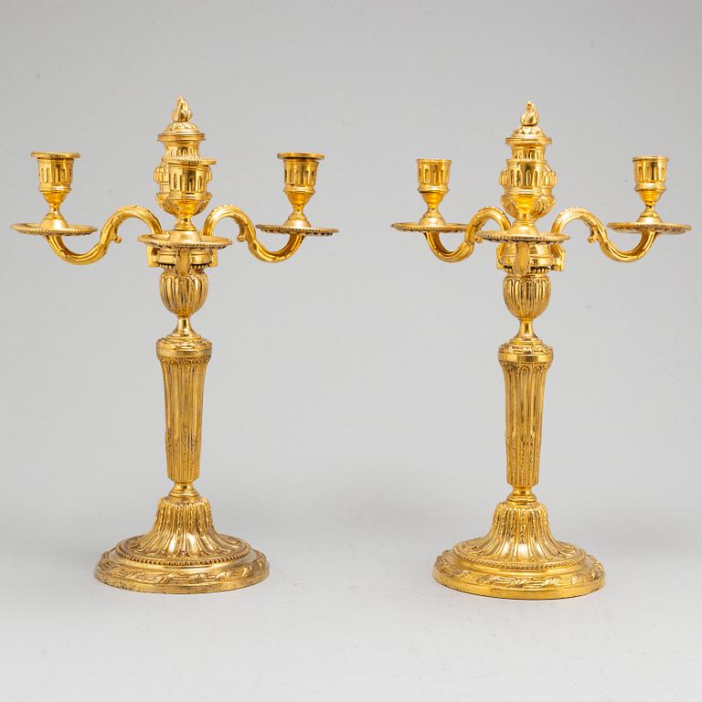 A pair of Louis XVI three-light candelabra.