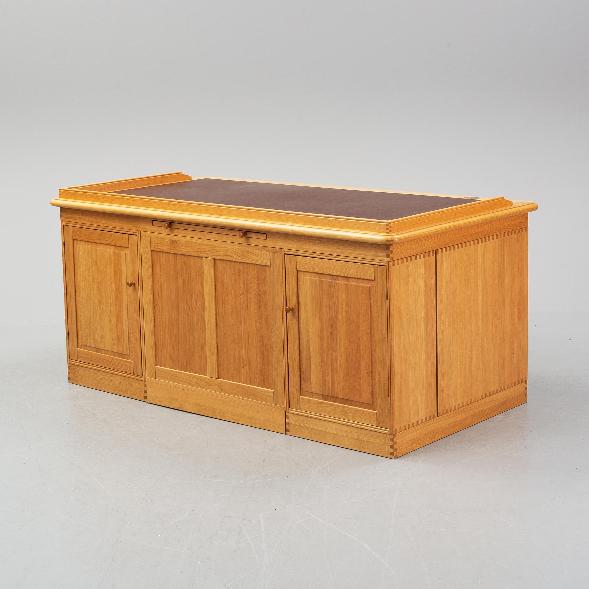 An oak writing desk by Finn N Hansen. End of the 20th Century.