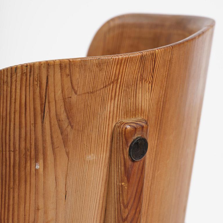 Axel Einar Hjorth, a pair of stained pine "Lovö" armchairs, Nordiska Kompaniet, Sweden, 1930s.