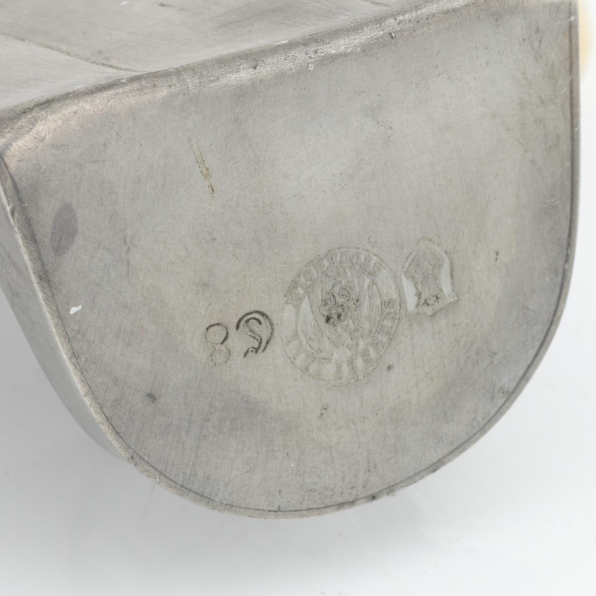Nils Fougstedt, A pair of pewter sconces and a mirror, Firma Svenskt Tenn, 1940 and -29.