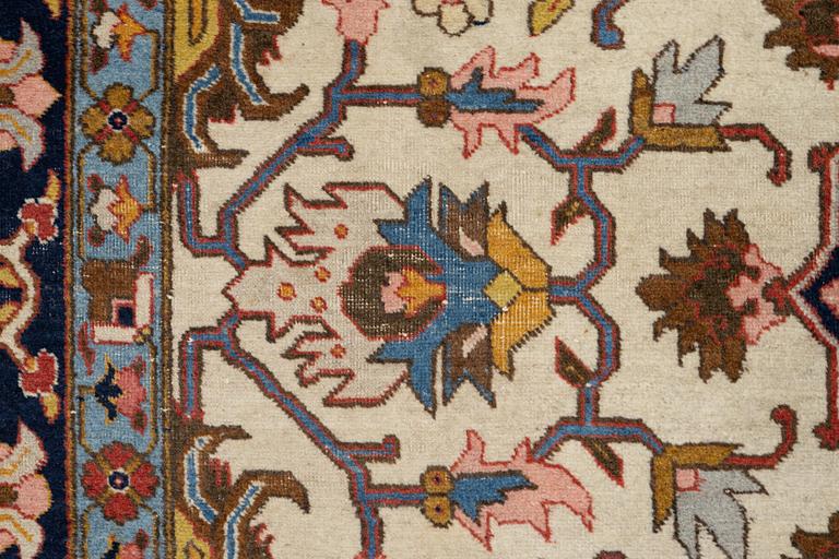 An antique Tabriz carpet, c. 365 x 280 cm.