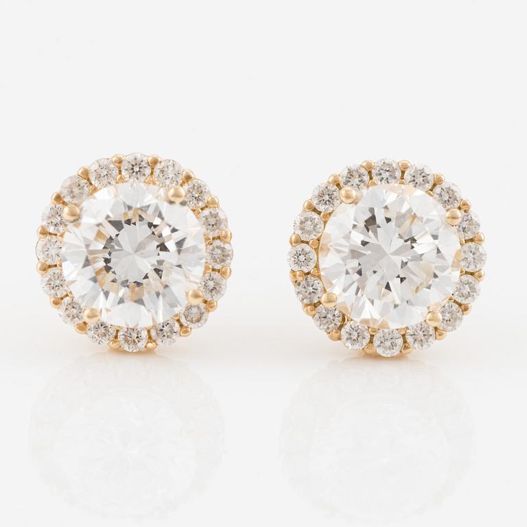 Earrings with brilliant-cut diamonds, including IGI report.