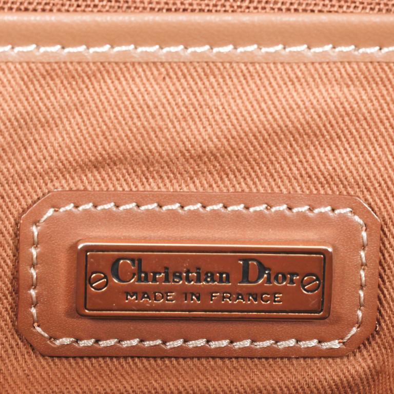 CHRISTIAN DIOR, a brown bag and briefcase.
