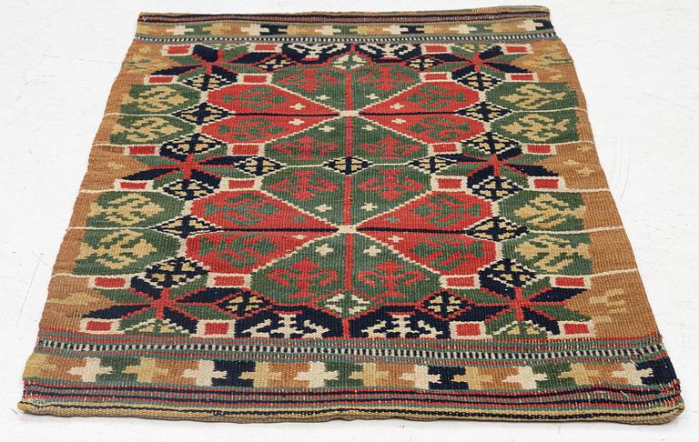 A carrige cushion, "Rosettes", flat weave, c. 88 x 58 cm, Skytts or Oxie district, southwestern Scania,.