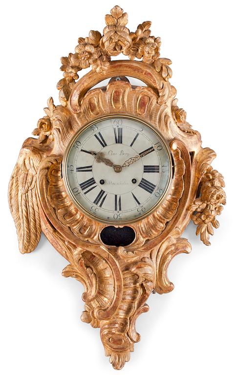A Swedish Rococo gilt wood wall clock by C. Berg.