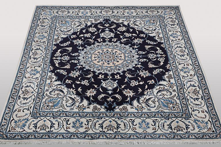 A carpet, Nain, part silk, ca 256 x 199 cm.