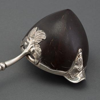 A silver and coconut rococo soup spoon, Sweden 18th century, marked LS.