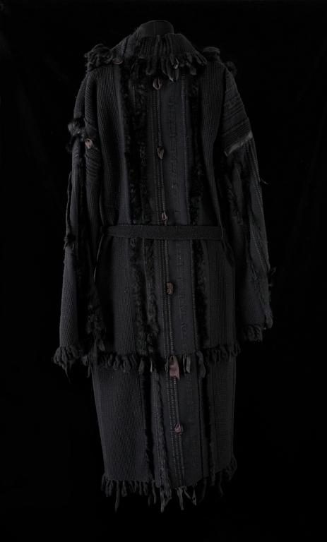 A black coat by Gucci.