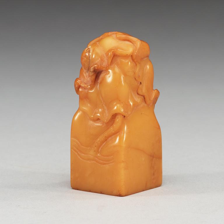 A yellow soapstone seal.