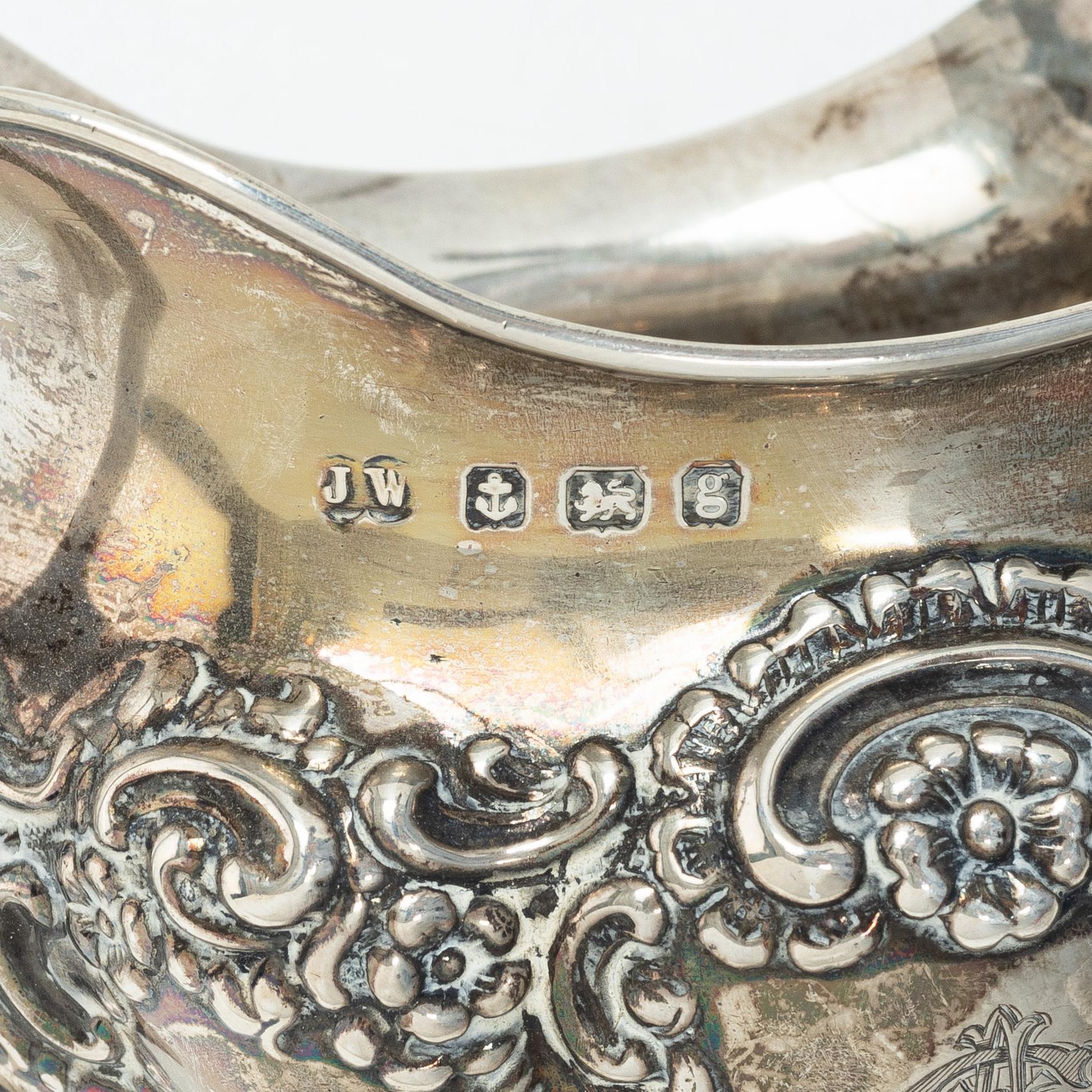 An English silver tea pot, sugar bowl and cream jug, Birmingham,  1904–1906.