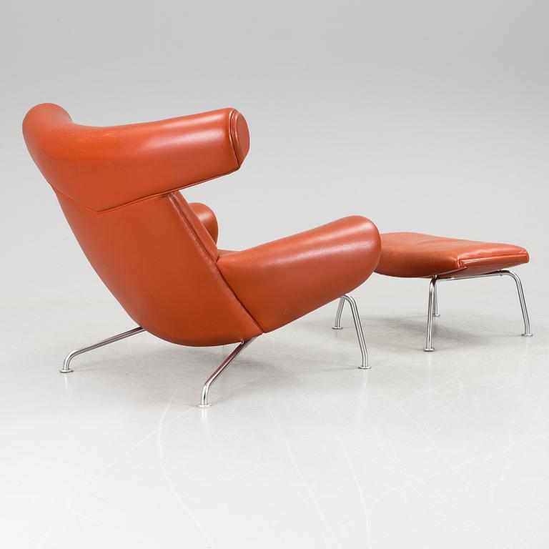 An "Ox-Chair" and foot stool by Hans J Wegner for Erik Jorgensen, Denmark.