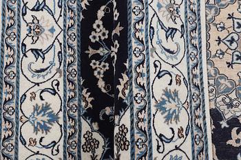 A carpet, Nain, part silk, ca 256 x 199 cm.
