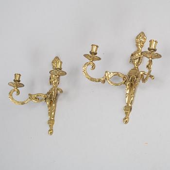 A pair of brass wall lights, Louis XVI-style, 20th century.
