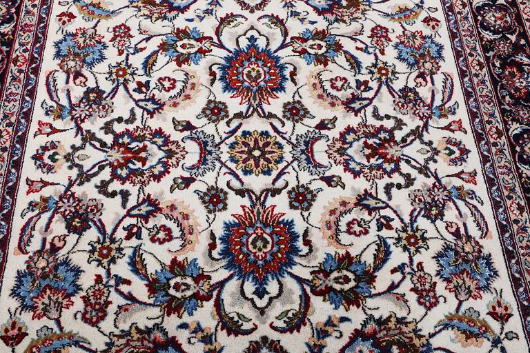 A Nain carpet, part silk, c. 294 x 201 cm.