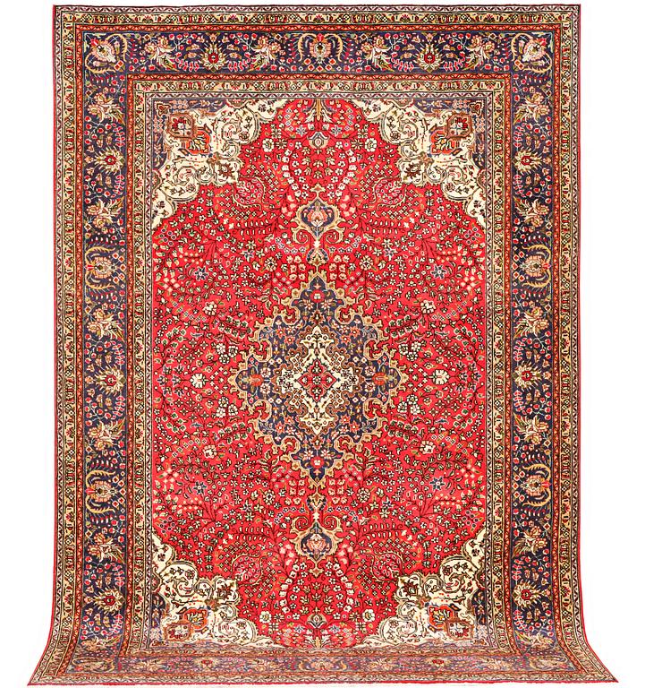 A Tabriz carpet, c 295 x 198 cm.