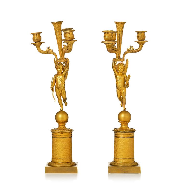 A pair of Empire ormula candelabras.