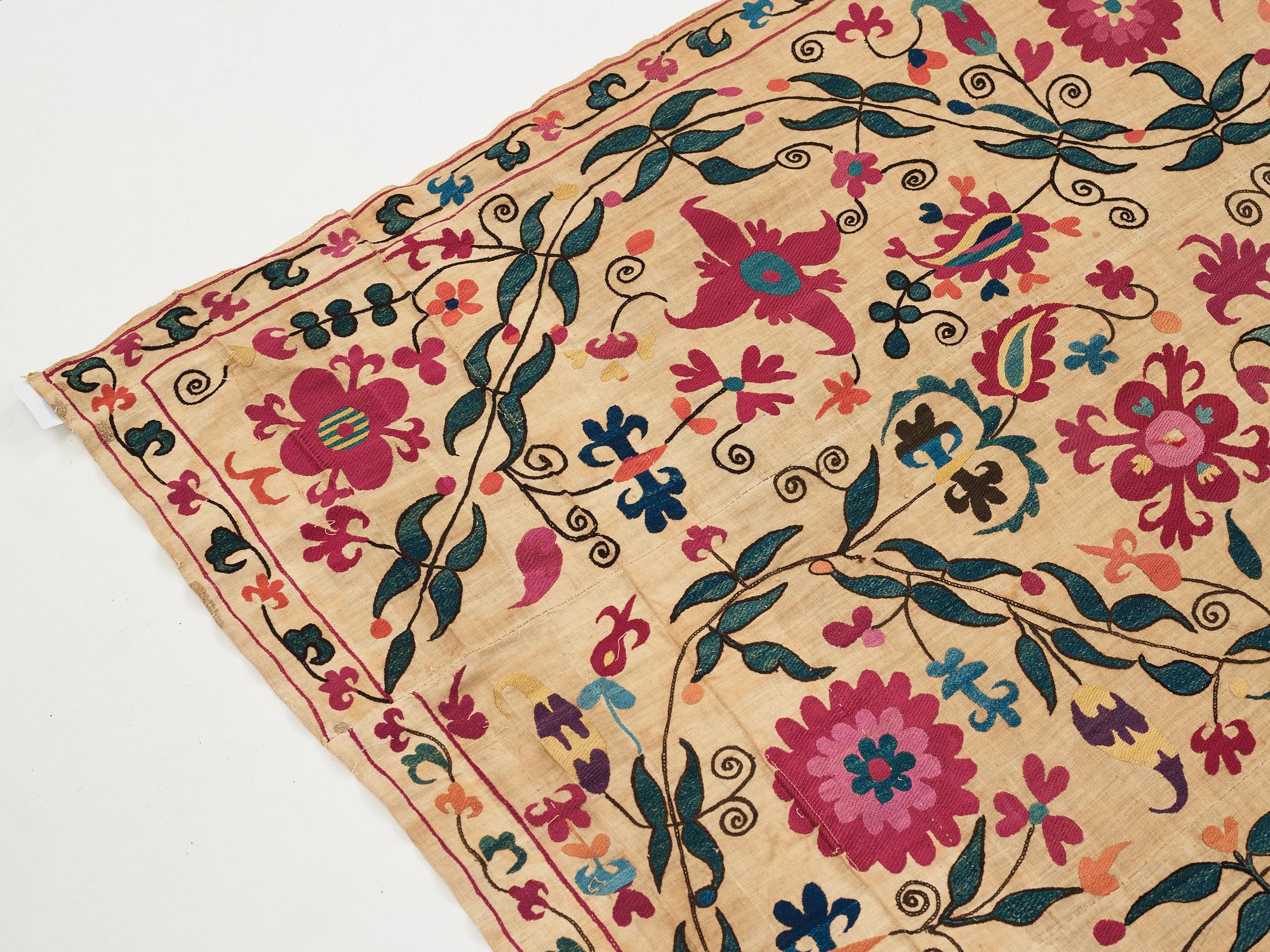 An embroidery, an antique suzani, Ura Tube or the Ferghana valley, ca 250,5-253,5 x 185,5-191,5 cm.
