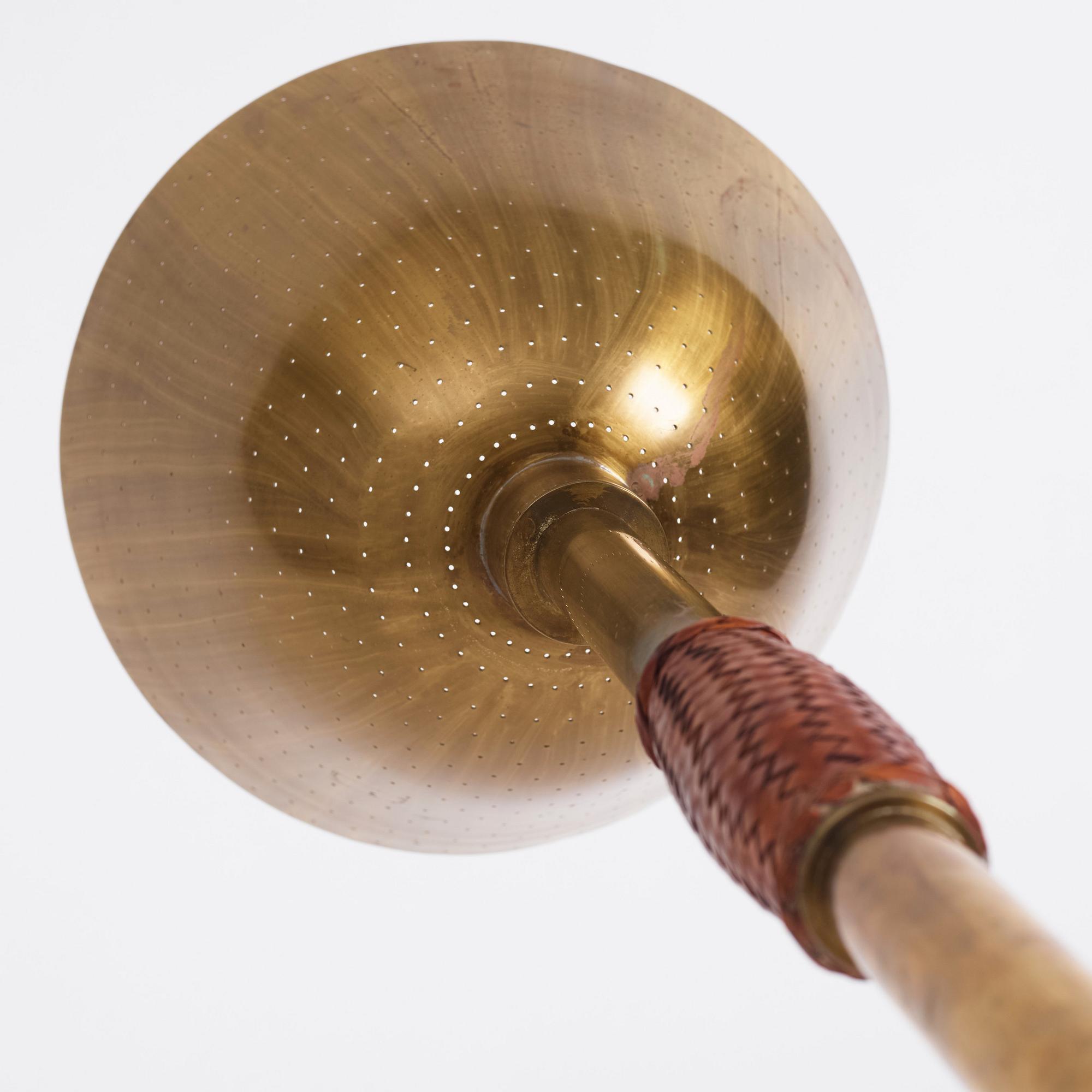 Carl-Axel Acking, a brass and leather floor lamp, designed for the Stockholm Association of Crafts in 1939.