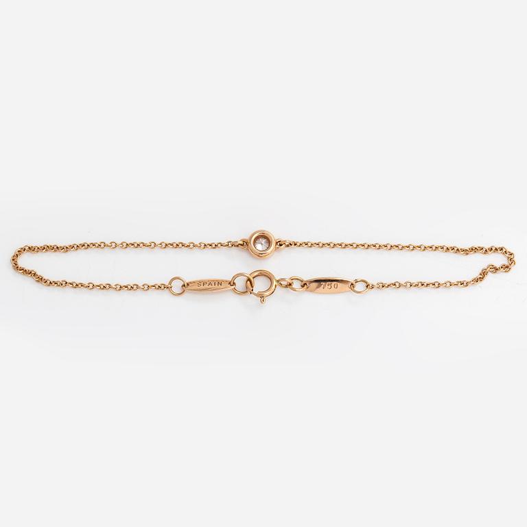Tiffany & Co, Elsa Peretti, an 18K gold bracelet with a brilliant cut diamond ca 0.07 ct.