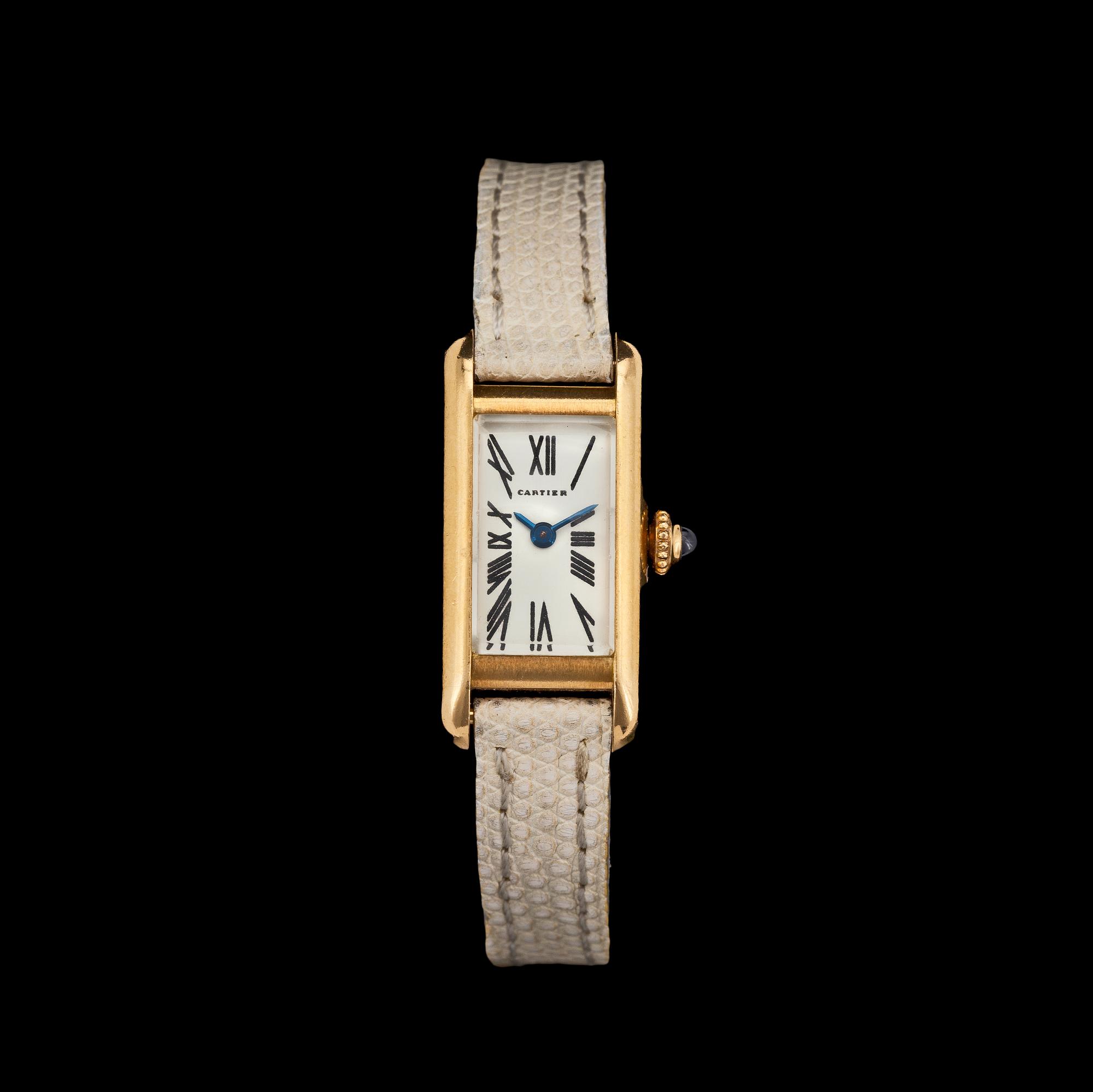 A Cartier gold ladie's wrist watch.