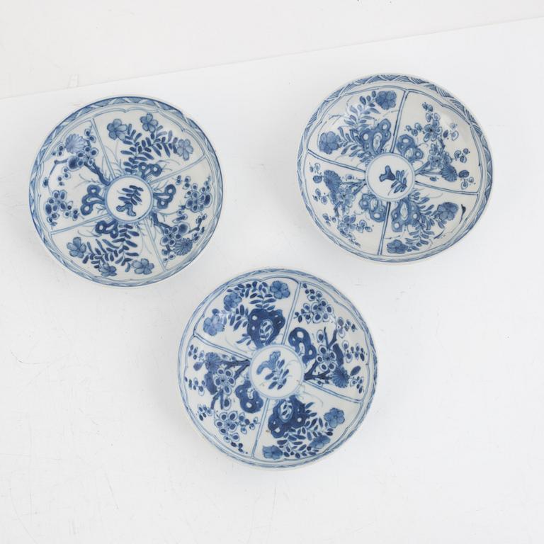Three Kangxi cups with saucers and five Qianlong cups with saucers, China, 18th century.