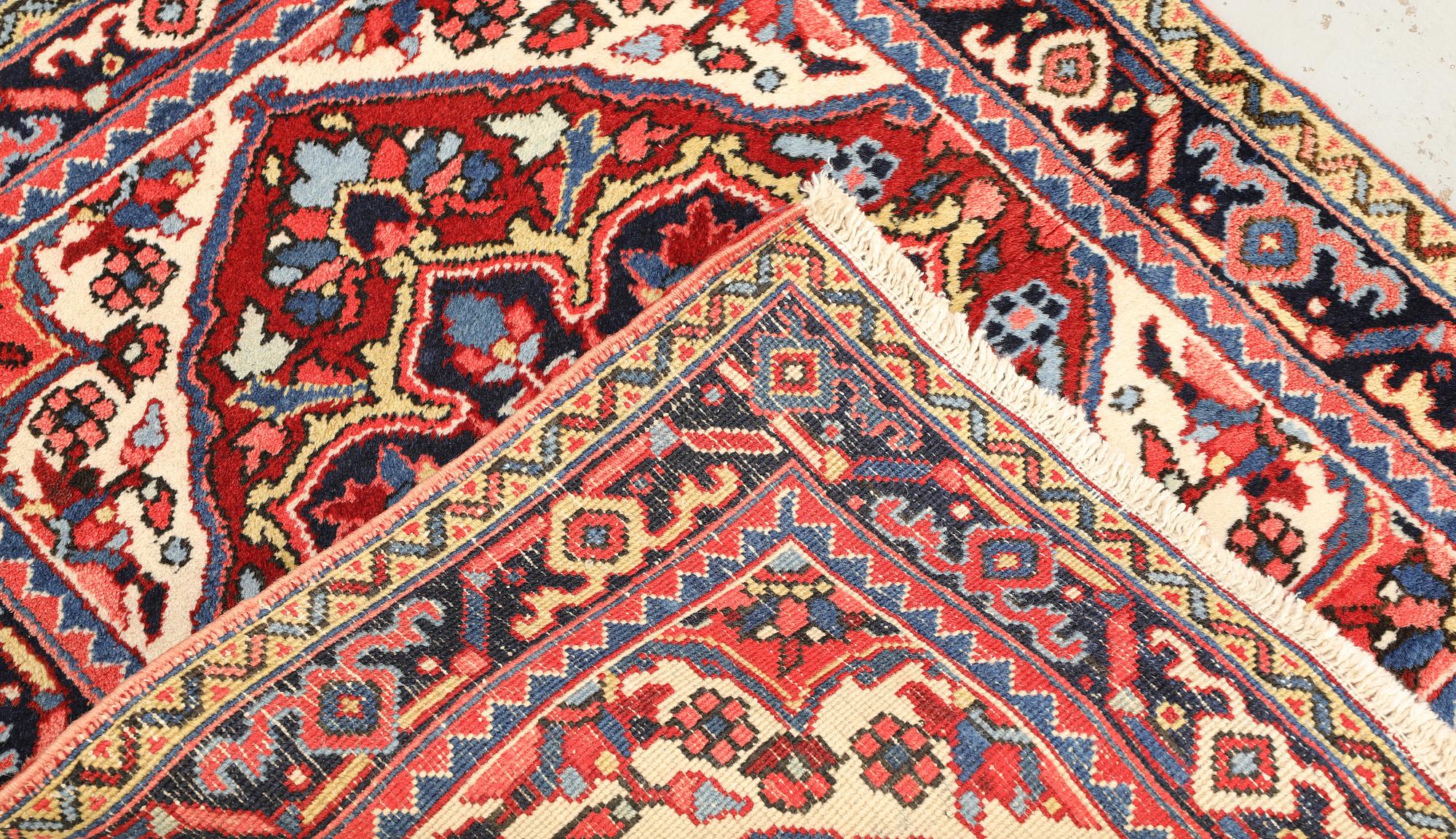 A Semi-antique Heriz rug, 90 x 78 cm.